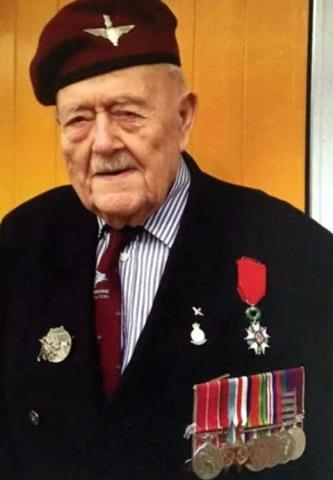 Cecil Lawrence BEM wearing maroon beret and a blazer with his medals