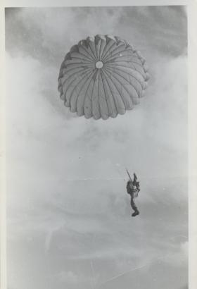Ernest John Lewis with his parachute deployed during a jump