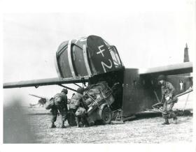 US soldiers unload a glider plane after landing near Wesel.