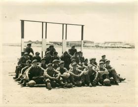 Group of troops await briefing during synthetic training.