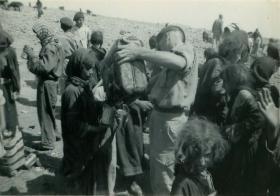 Members of 3 PARA give water to refugess in Amman, Jordan 1958 P1