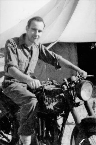 Leslie Martin on a motorcycle in Palestine
