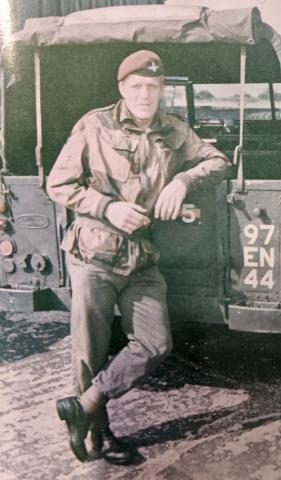 OS Terry McGarrigle leaning on Army Land Rover