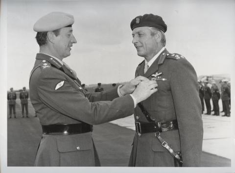 Brigadier Ward Booth being presented with the Army Flying Badge by the retiring Director of AAC, 1976