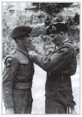 RSM Johnson receiving the Military Medal from Field Marshal Montomery, 1944.