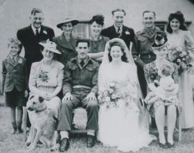 Moore Family Photo with ParaDog Pat on the left, and Lt Keith Moores wife and son on the right.