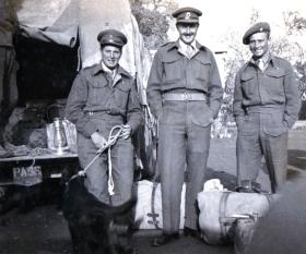 John B Sanderson with the regimental Mascot Dog, Susan and colleagues 1945