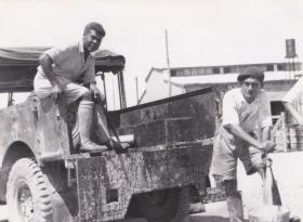 Civilian sanitary staff wash down 'swill' truck, 3 Para, Wayne's Keep Nicosia 4 August 1951