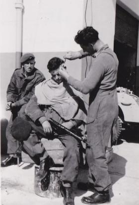 Haircut, (clippers plugged into street lamp), Ismailia 25 Jan 1952