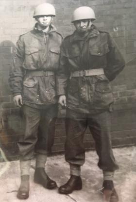 Pte Francis Turner and friend wearing airborne helmets