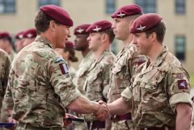 Brigadier Nick Cowley, Commander of 16 Air Assault Brigade Combat Team, shakes the hand of a 3rd Battalion The Parachute Regiment soldier.