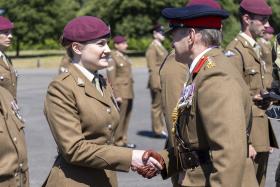  Private Sophie Robertson, of 23 Parachute Engineer Regiment, is congratulated by Lieutenant Colonel Matthew Quare, Corps Colonel of the Corps of Royal Engineers