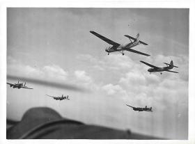 View from an Anson aircraft of Horsas being towed by Whitleys