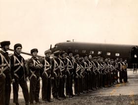 AA Instructors and pupils in line ready to board a Dakota