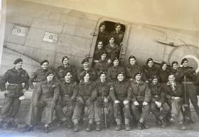 OS Cpl Jeffrey Byford and fellow comrades by a Dakota