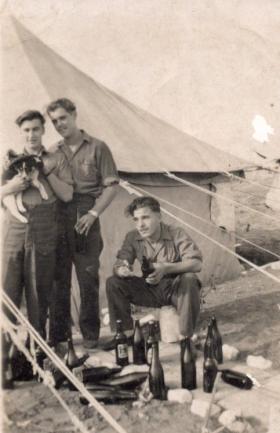 Private Leslie Jenner and men of 7th Bn. relaxing 