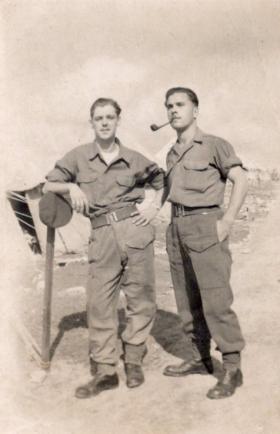 Private Leslie Jenner smoking a pipe in Palestine with a friend