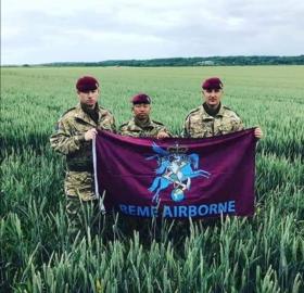 OS Airborne REME flag held in corn field