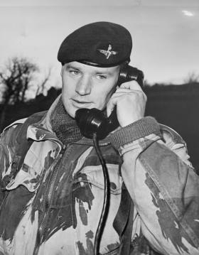 Norman Edward Menzies MBE (1960s) using a telephone