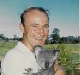 Reverend Paul Abram pictured with a koala on exercise in Australia, 1966