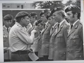 Major General Anthony Ward-Booth giving jump wings to German paratroopers