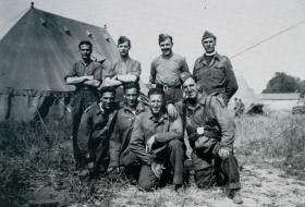 OS Members of ‘S’ Company’s Mortar Detachment from the Mortar Platoon and the Padre, 1st Bn. Hurn Airfield. July 1942.