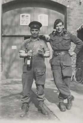 Canadian Paratroopers Sam Malette and 'Sullivan' with liberated wine, 1945