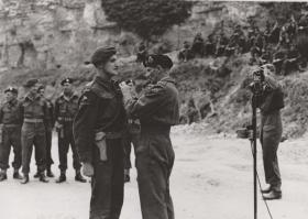 Field Marshal Montgomery pins a gallantry award on a Canadian Paratrooper