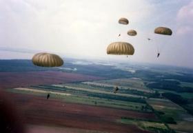 Parachutists of 10 PARA perform a clean fatigue jump from a Luftwaffe Transall C-160, Germany, Summer 1989.