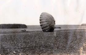A member of 8th Parachute Battalion lands on a training exercise, Salisbury Plain (?), c1944.