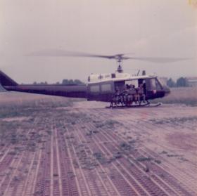 Members of 16 Lincoln Coy being lifted in a Huey for a heli jump, 1970s
