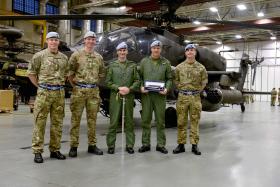 The Attack Helicopter Display Team after being presented with the Pooley Sword, November 2014.