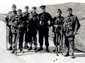 Members of a section from A Coy, 1 PARA, with a Turkish Cypriot Policeman, at the base of Kyrenia Mountains, Cyprus, 1956.