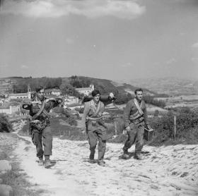 Members of 2 SAS climb a mountain path in Italy, 1945.