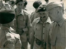 General Eisenhower talks to an officer.