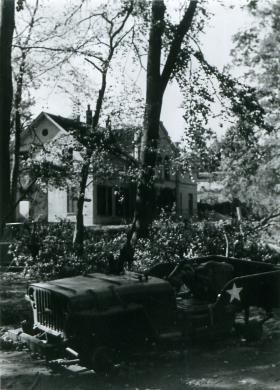 A burnt out Jeep belonging to 1st Airborne Reconnaissance Squadron in leafy Oosterbeek.