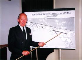 Major Mike Walsh with a map of El Gamil airfield at a Suez lecture in 1996.