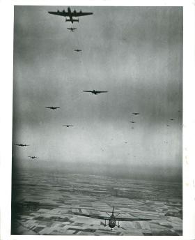 Halifaxes tow Horsa gliders over the French coast.