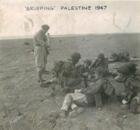 Men being briefed for an exercise in Palestine, 1947.