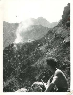 A 3 PARA soldier observes Hunter fighter-jet attack near the Wadi Dhubson, May 1964.