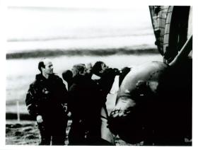 Padre David Cooper supervises casualty evacuated by helicopter. 