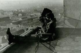 Paratrooper on a rooftop observation post.