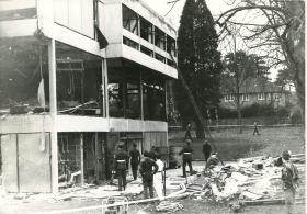 The destruction done to the Officers' Mess by an IRA bomb can be seen.