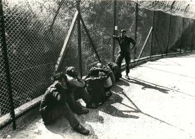Refugees apprehended at the border and awaiting transportation, Hong Kong, 1980