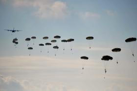 Paratroopers from 3 PARA descend following a drop by a French Air Force C130 aircraft during Exercise Joint Warrior, 2012.