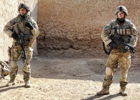 Soldiers from 3 PARA pause whilst on foot patrol, Afghanistan, 2011
