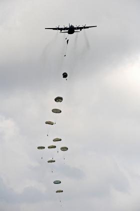 Paratroopers descend to earth from a Royal Air Force Hercules aircraft during a demonstration of their skills, 2012.