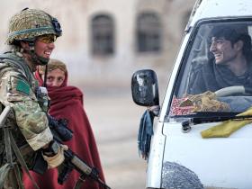 A soldier from 3 PARA talks to a young motorist in Naqilabad Kalay, Afghanistan, 2011