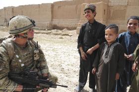 A Soldier from A COY,  3 PARA Talking with Local Children, Showal, Afghanistan, 2011