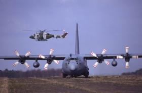 4 Regt AAC Lynx covers the landing of a C130 on exercise